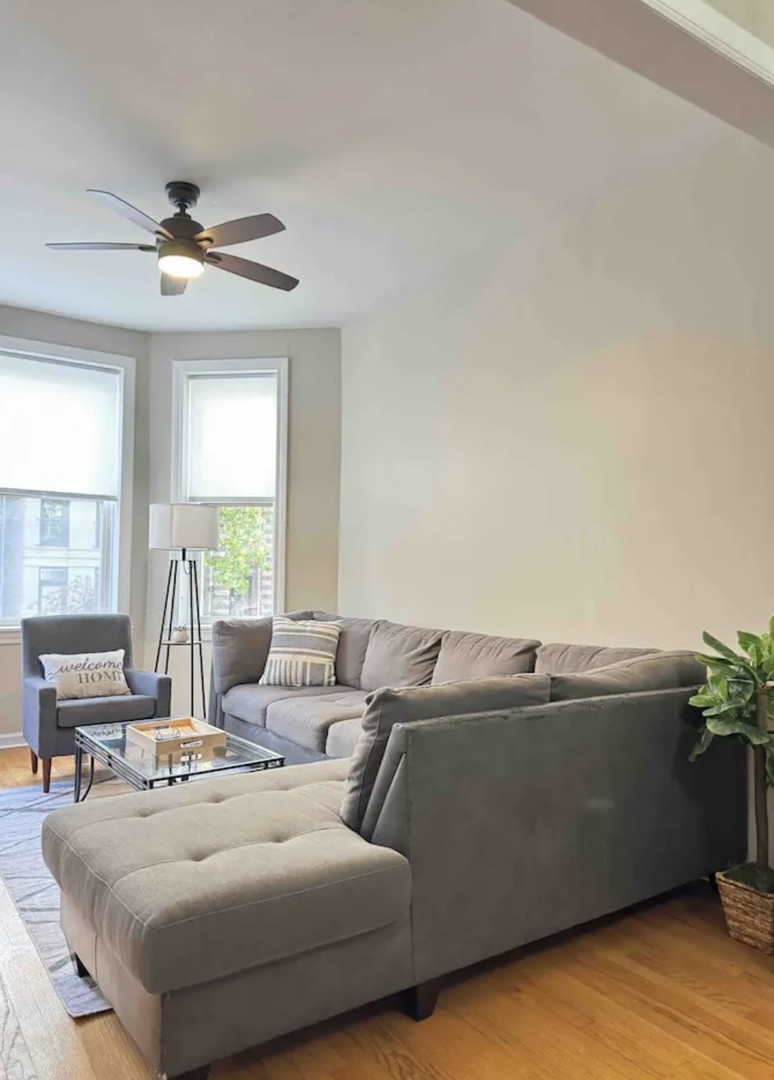 2140 West Crystal Street Chicago, IL 60622 - Photo 3 of 8 a living room with furniture and a large window