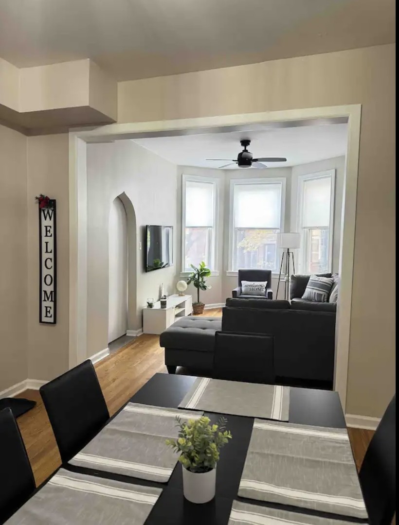 2140 West Crystal Street Chicago, IL 60622 - Photo 5 of 8 a living room with furniture and a large window