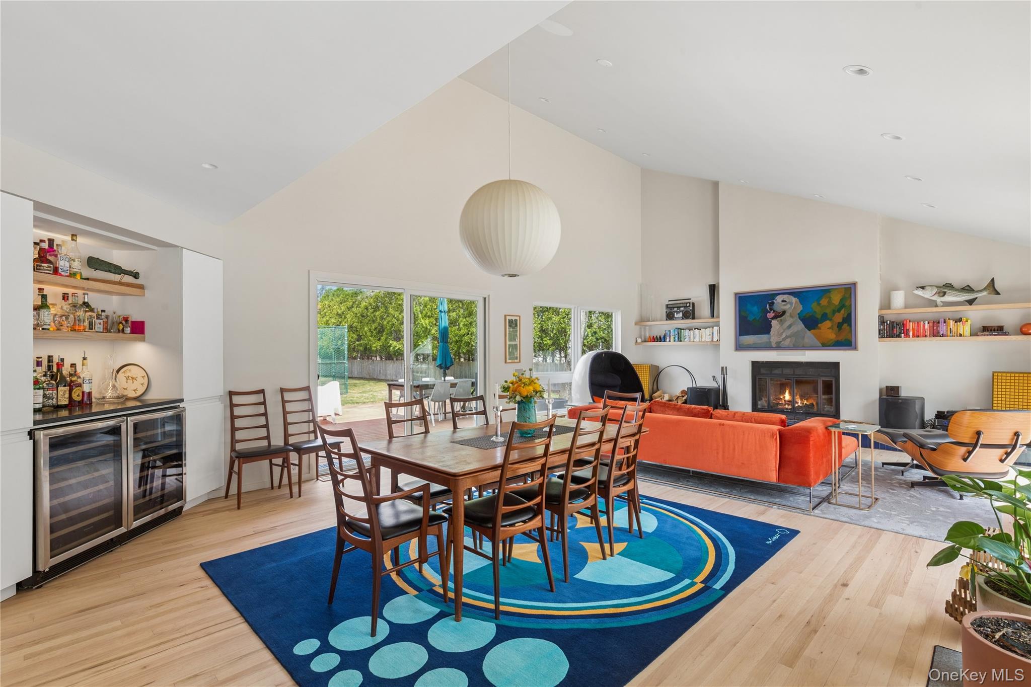 2 Acorn Path Quogue, NY 11959 - Photo 4 of 16 Open-concept living area with wood-finish flooring and a vaulted ceiling