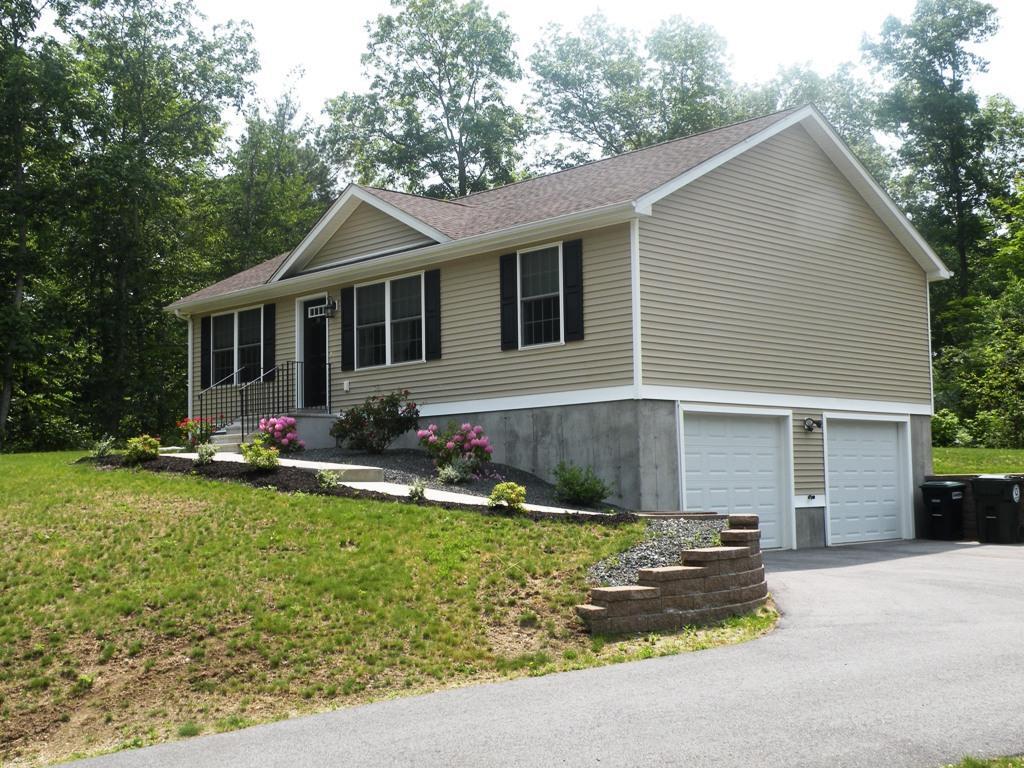 19 Herrick Road Brooklyn, CT 06234 - Photo 1 of 1 a front view of a house with a yard and garage