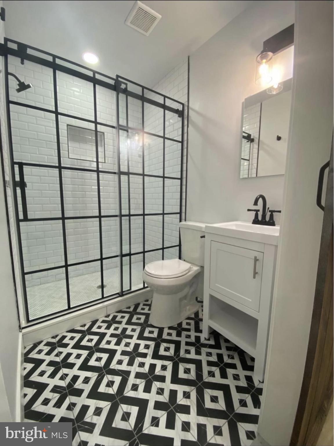 1324 North 5th Street, Unit 2F Philadelphia, PA 19122 - Photo 2 of 3 a bathroom with a sink toilet and shower