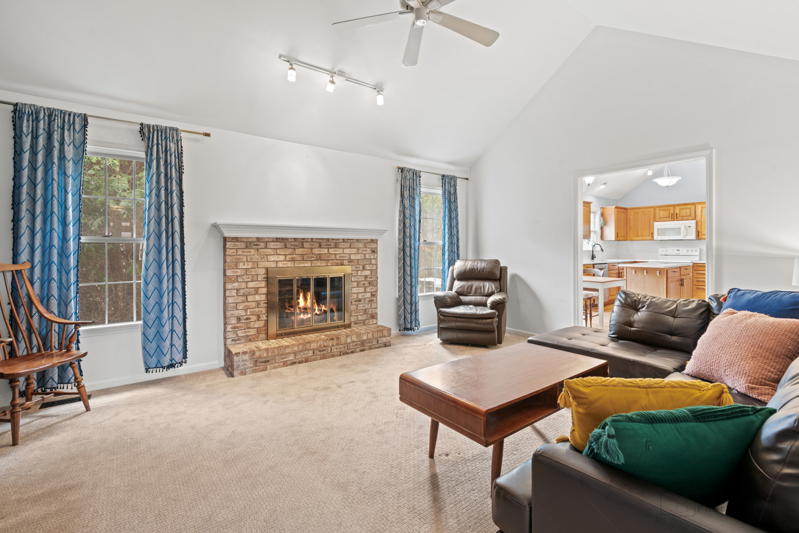 3620 Lakeview Drive Algonquin, IL 60102 - Photo 11 of 25 a living room with furniture a fireplace and a flat screen tv