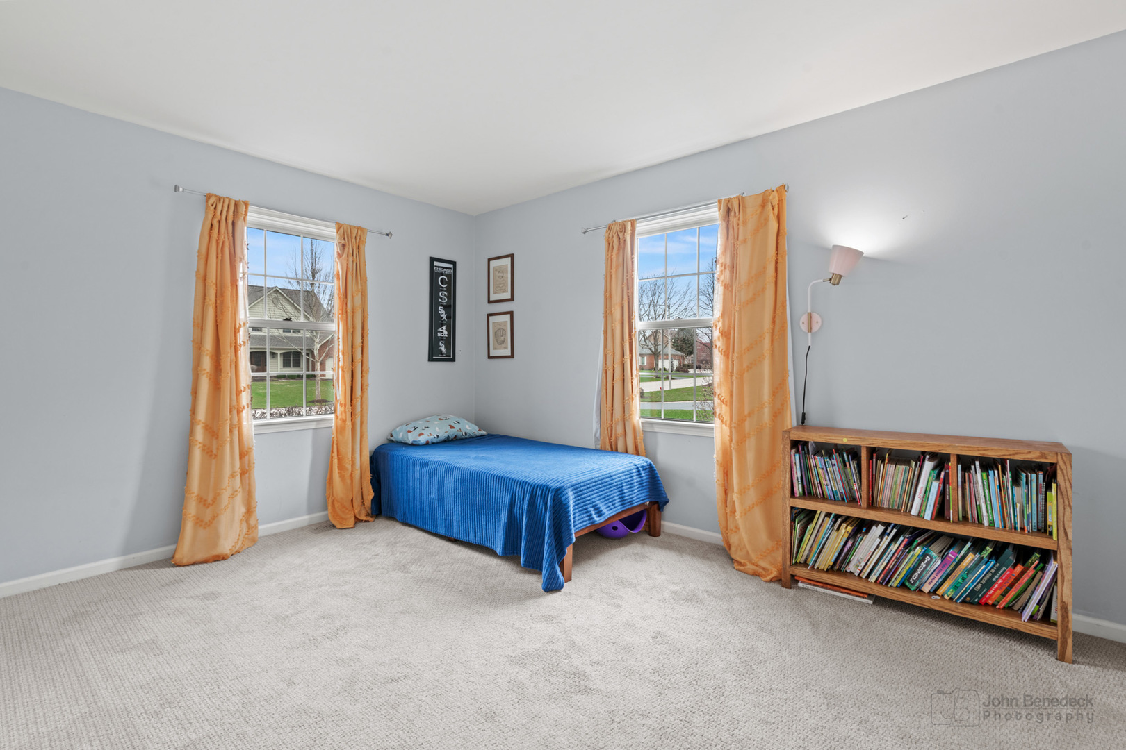 3620 Lakeview Drive Algonquin, IL 60102 - Photo 17 of 25 a living room with a bed and a book shelf