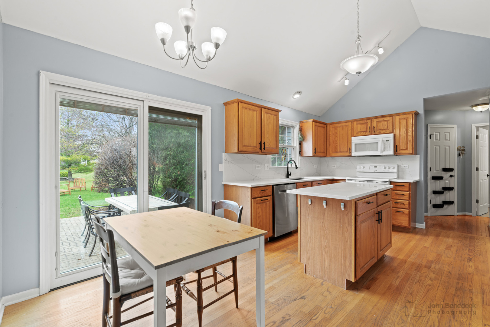 3620 Lakeview Drive Algonquin, IL 60102 - Photo 6 of 25 a large kitchen with kitchen island granite countertop a stove a sink a dining table and chairs