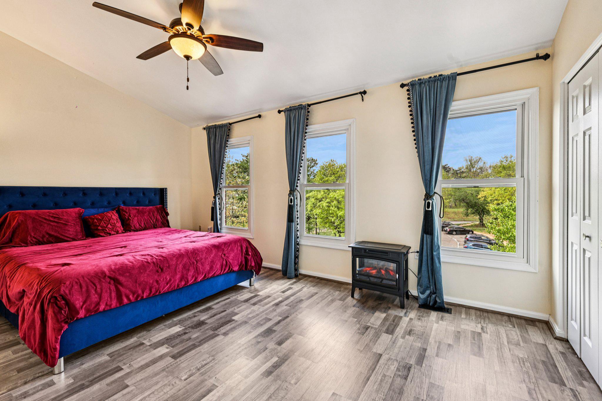 7371 St Thomas Loop Manassas, VA 20109 - Photo 11 of 31 a bedroom with a bed and a chandelier