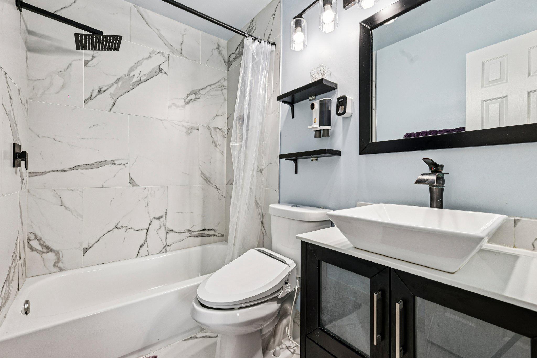 7371 St Thomas Loop Manassas, VA 20109 - Photo 13 of 31 a bathroom with a sink toilet and shower