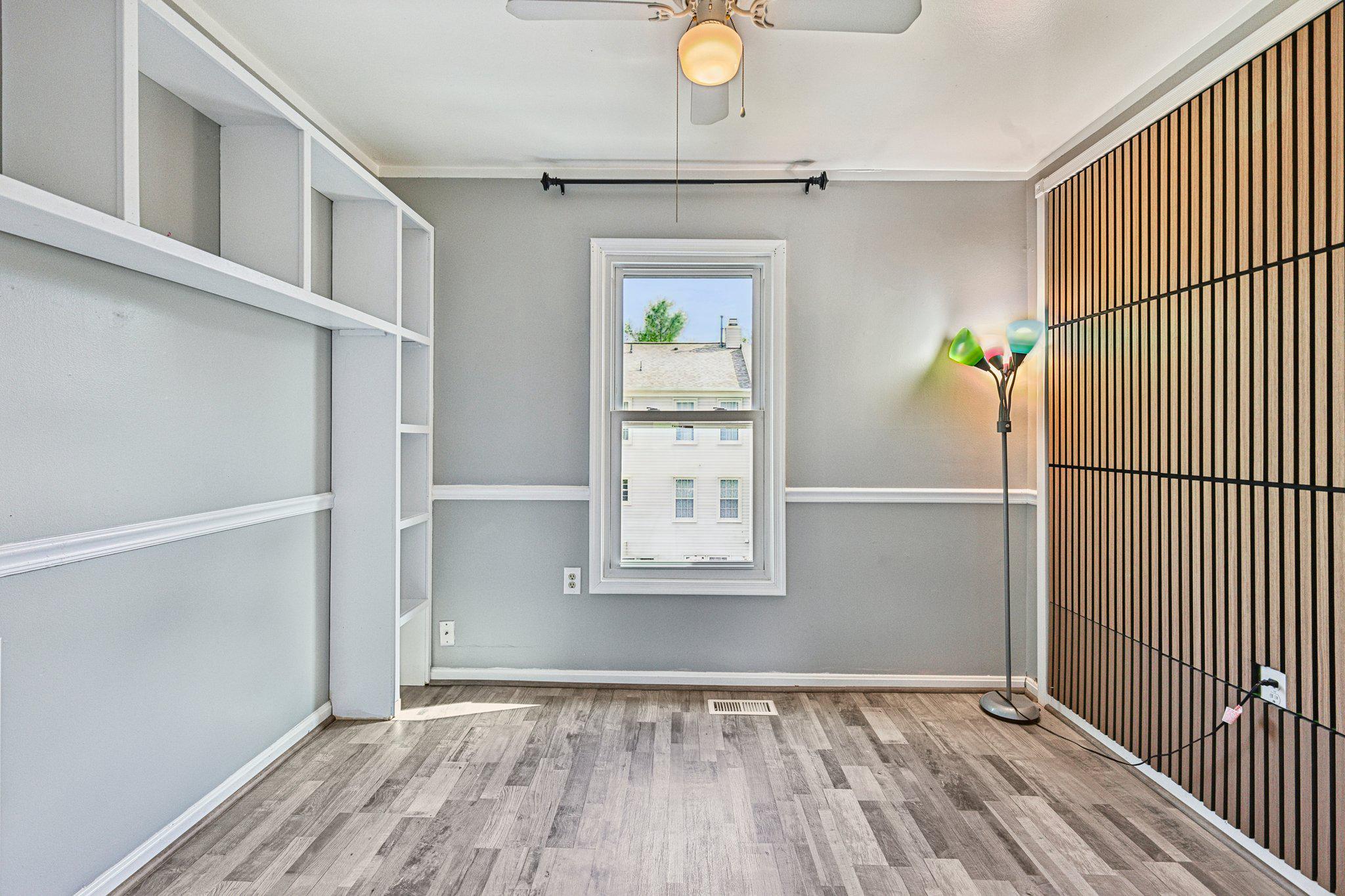 7371 St Thomas Loop Manassas, VA 20109 - Photo 17 of 31 a view of an empty room with wooden floor and a window