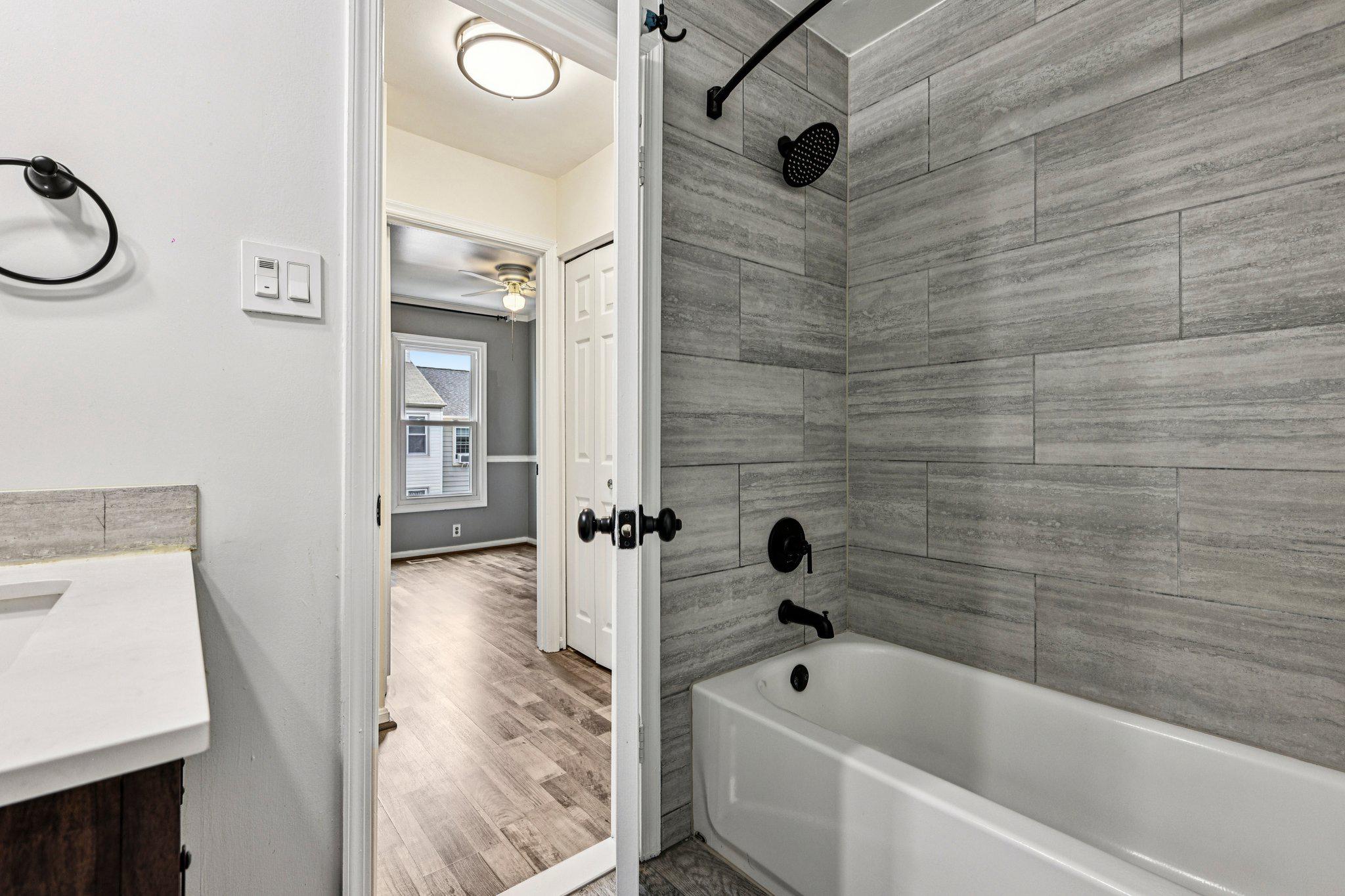 7371 St Thomas Loop Manassas, VA 20109 - Photo 19 of 31 a bathroom with a tub a sink and a shower