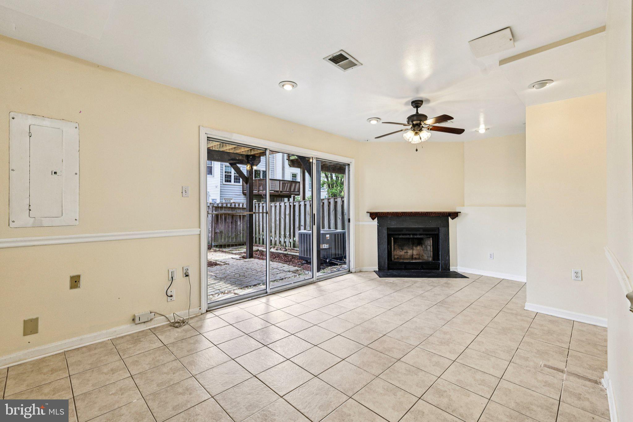 7371 St Thomas Loop Manassas, VA 20109 - Photo 20 of 31 a view of a livingroom with a fireplace and window
