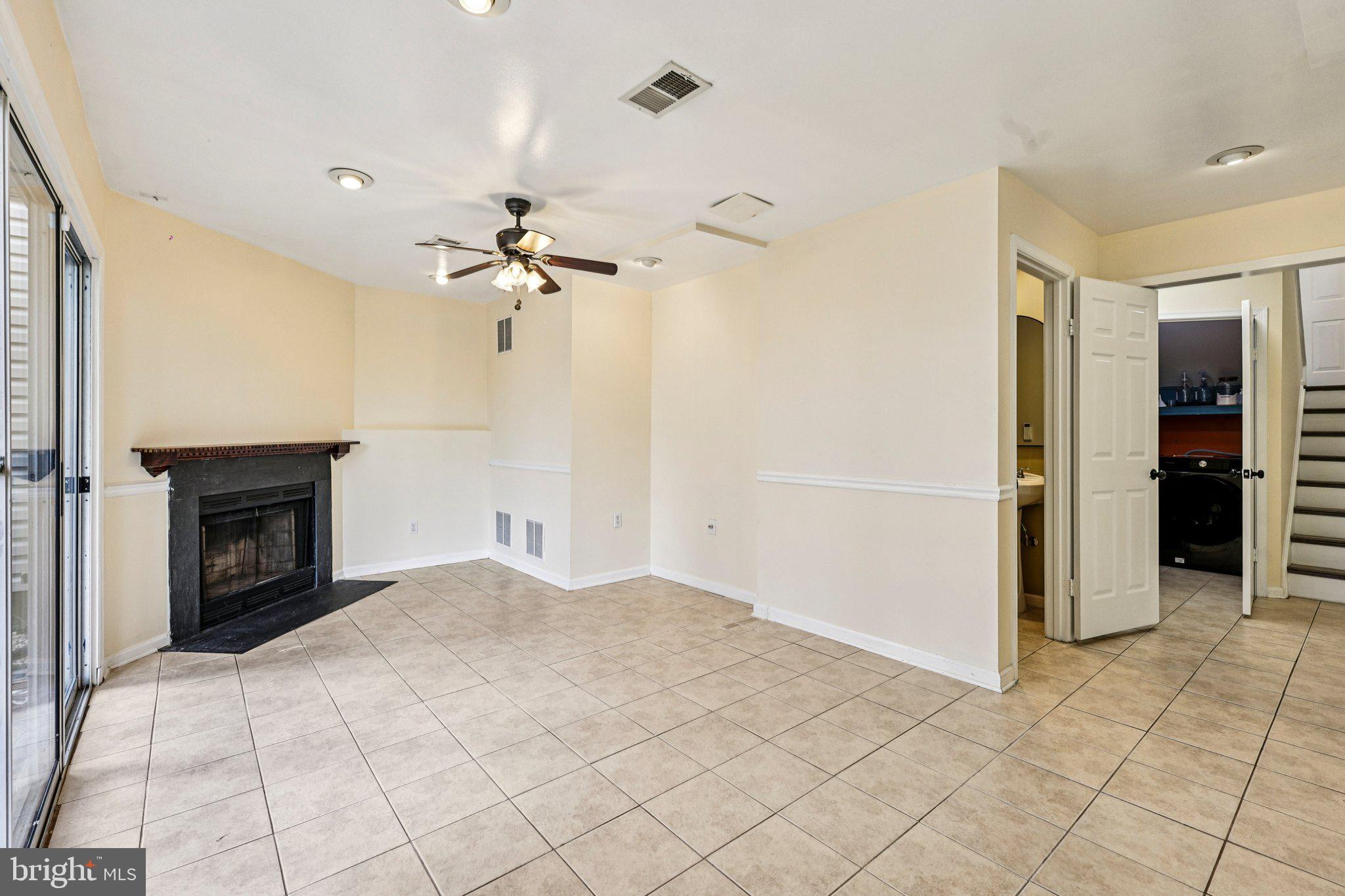 7371 St Thomas Loop Manassas, VA 20109 - Photo 21 of 31 a view of an empty room with a fireplace