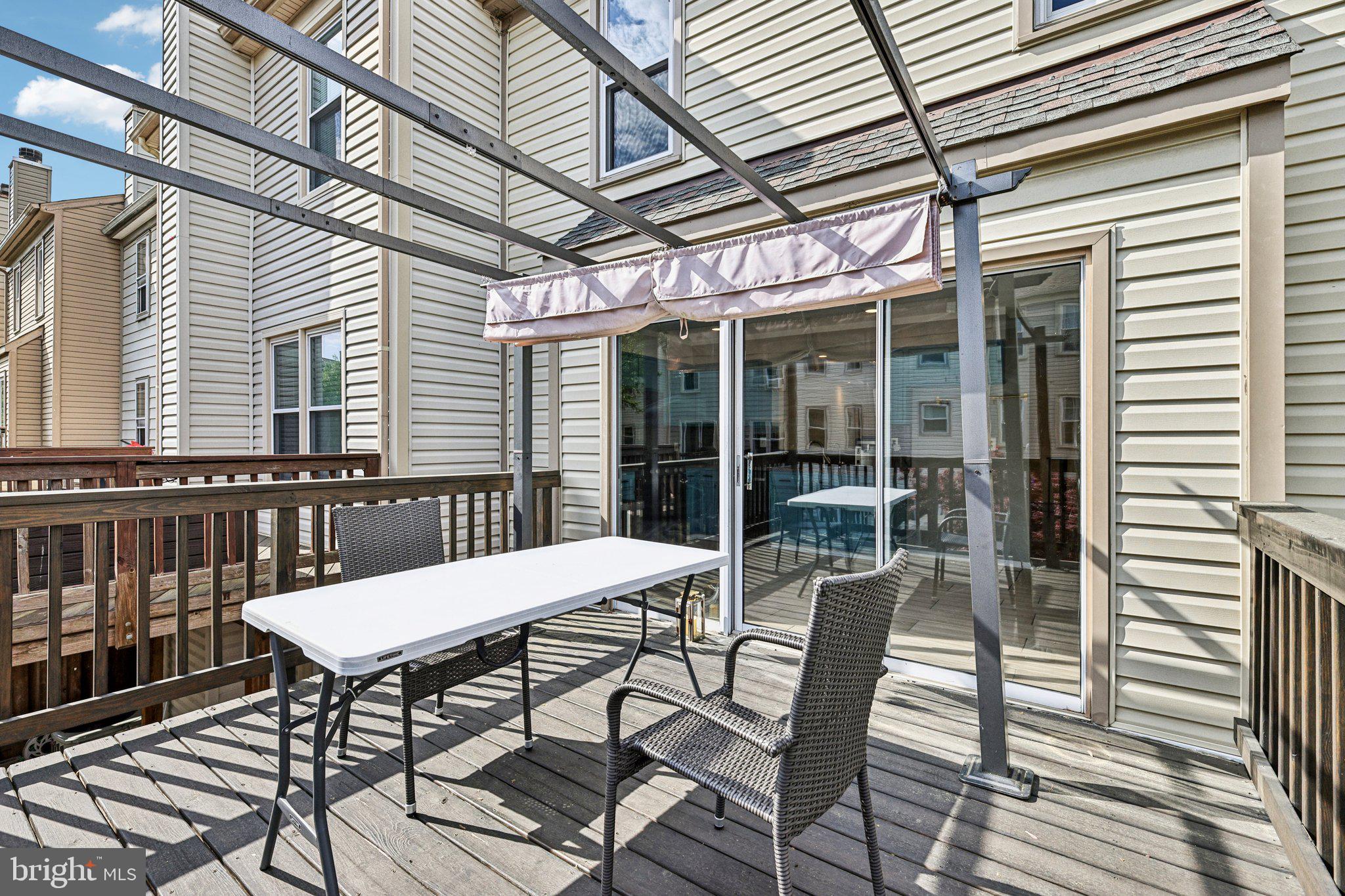 7371 St Thomas Loop Manassas, VA 20109 - Photo 24 of 31 a view of a patio with table and chairs and potted plants
