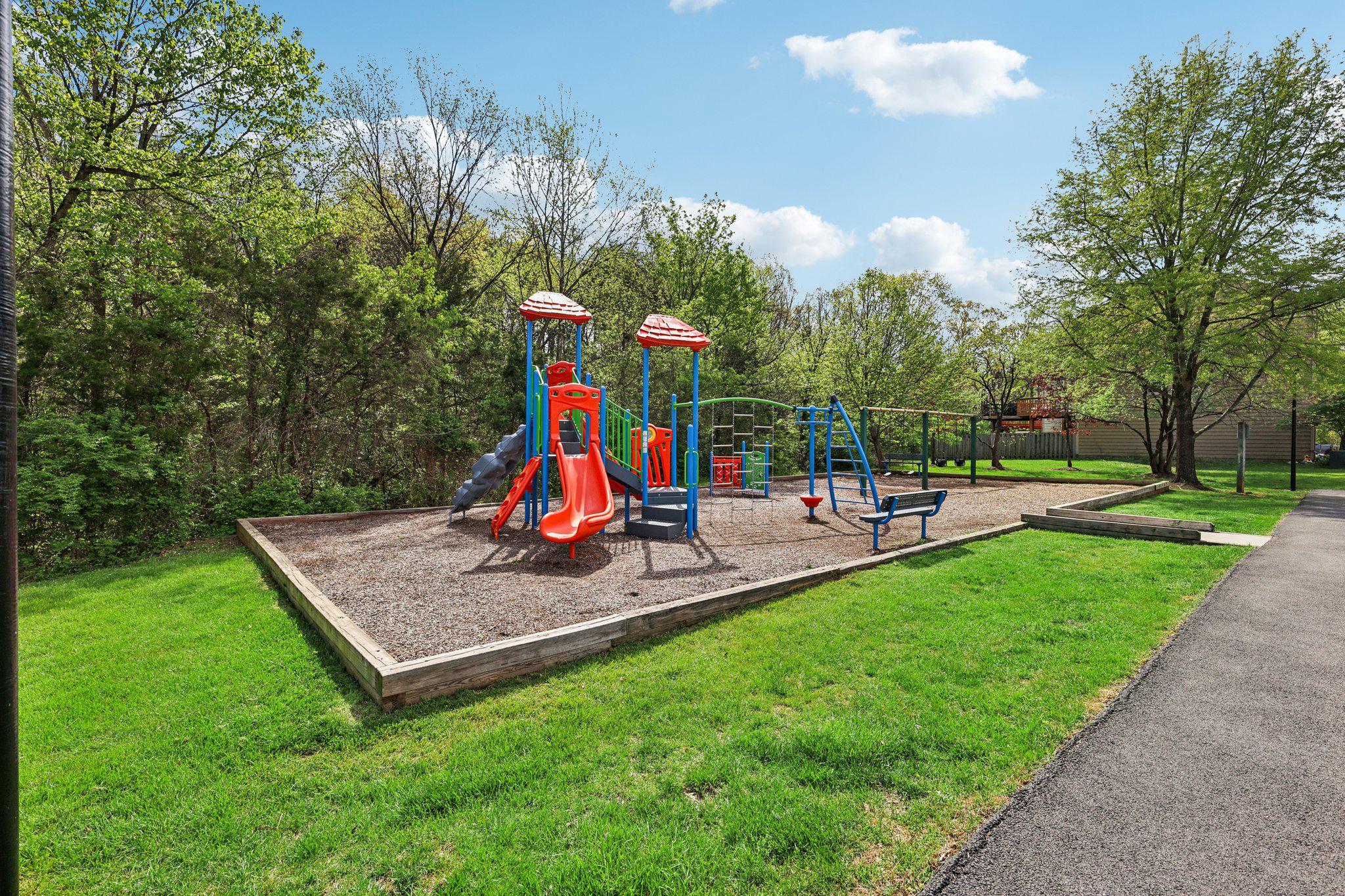 7371 St Thomas Loop Manassas, VA 20109 - Photo 27 of 31 a childrens park with lots of swings and slides