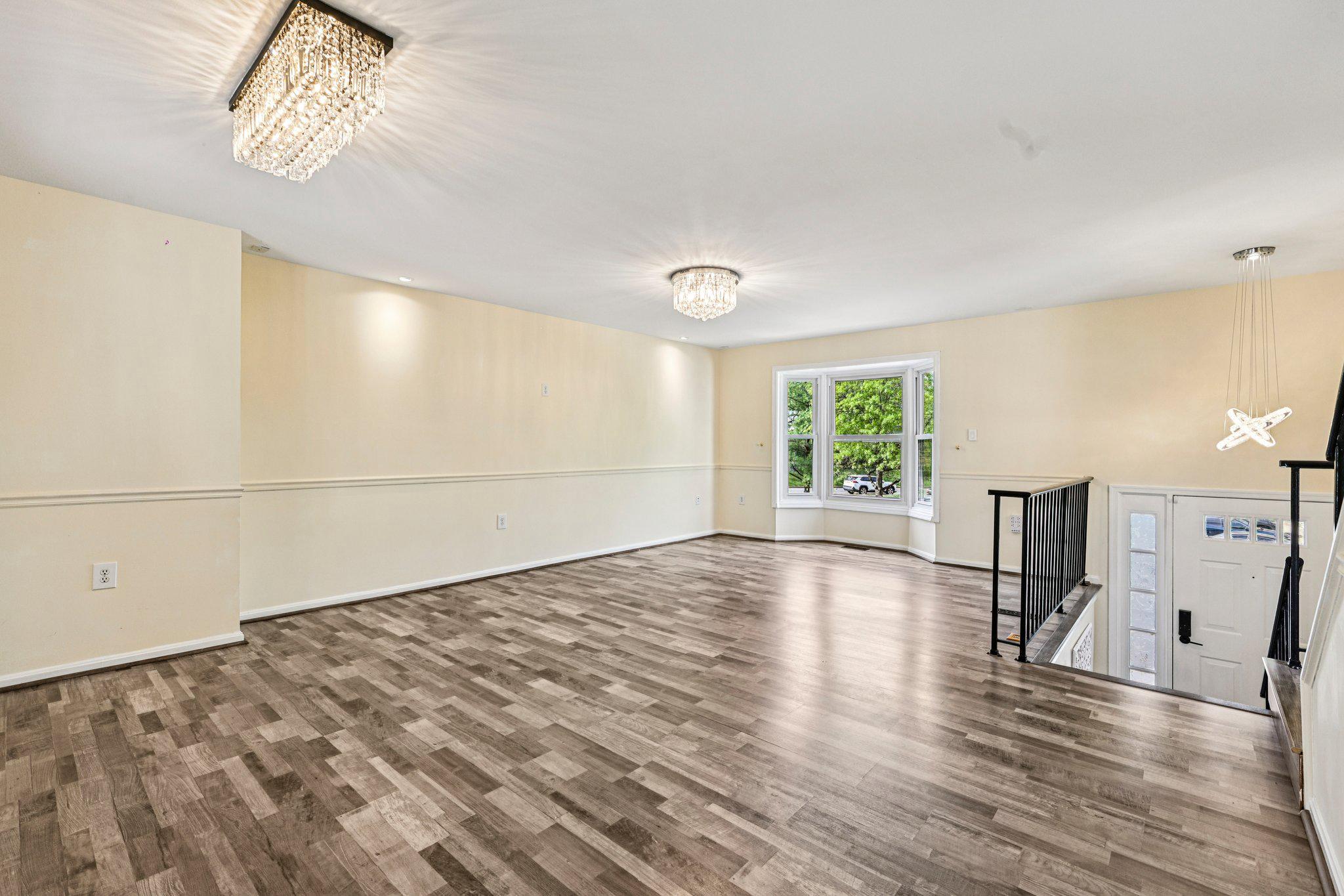 7371 St Thomas Loop Manassas, VA 20109 - Photo 5 of 31 a view of empty room with wooden floor and fan
