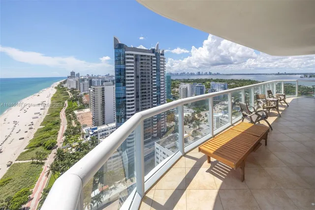 a living room with furniture flat screen tv and a fireplace
