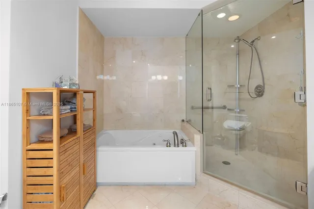 a outdoor space with the couches and dining table with the potted plants