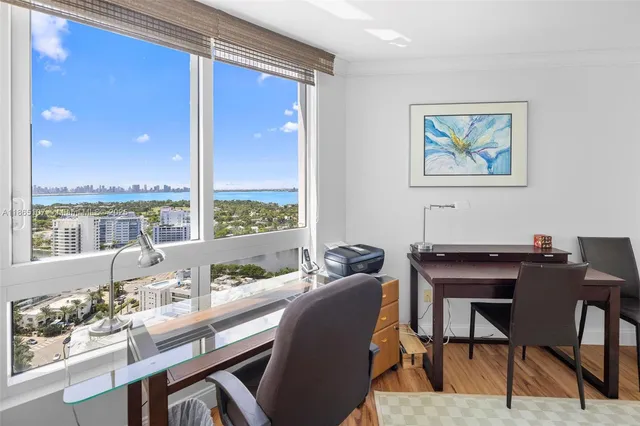 a dining area with a table and chairs
