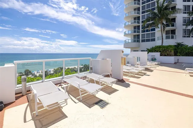 a lobby with furniture and floor to ceiling window