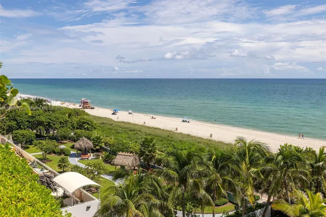 a bathroom with a glass shower door and a bathroom