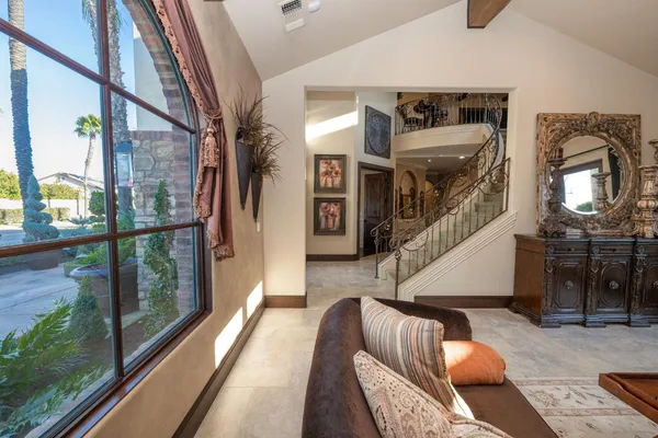a living room with furniture ceiling fan and a fireplace