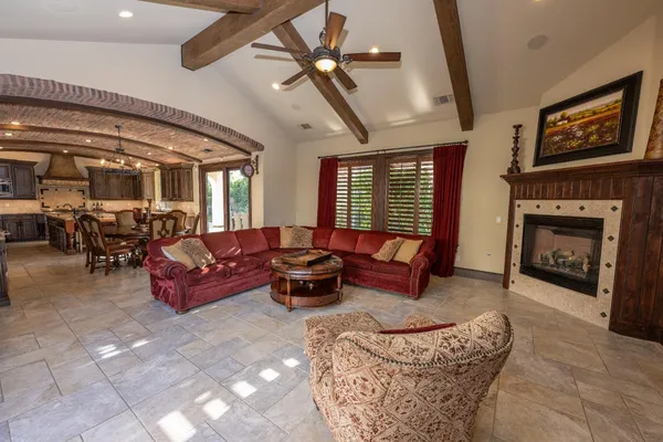 a kitchen with stainless steel appliances granite countertop a sink and a refrigerator