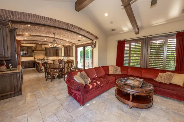 a view of a patio with table and chairs and potted plants