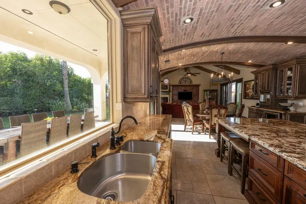 a large bathroom with a tub a double vanity sink a mirror and a bathtub