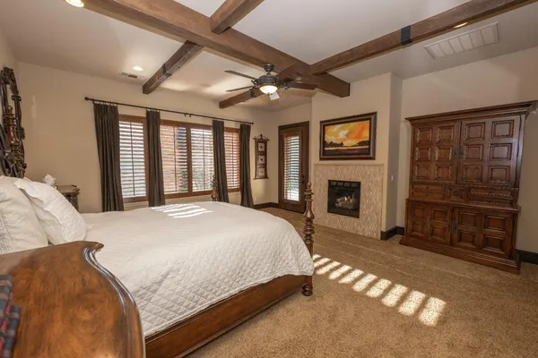a bed sitting in a bedroom next to a window