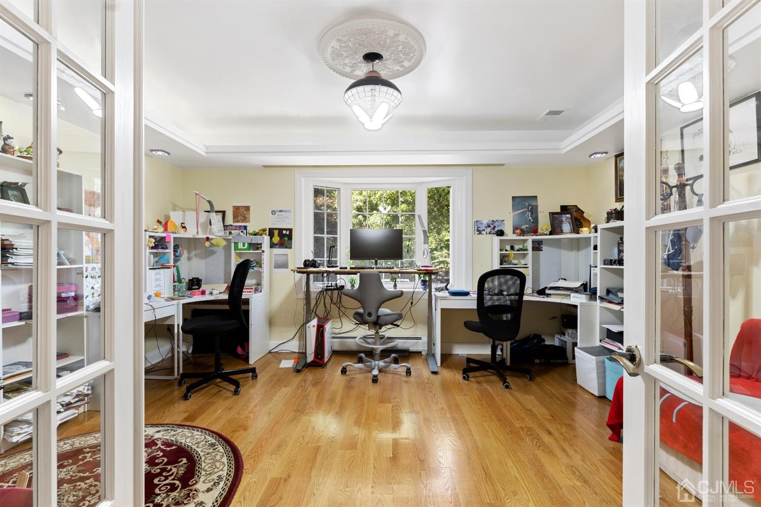 429 Plainfield Road Edison, NJ 08820 - Photo 11 of 26 a view of a livingroom with workspace and a window