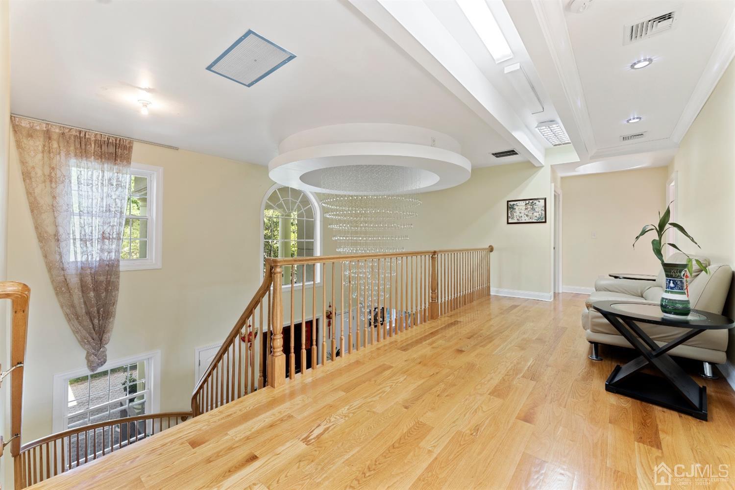 429 Plainfield Road Edison, NJ 08820 - Photo 14 of 26 a view of a livingroom with wooden floor and stairs