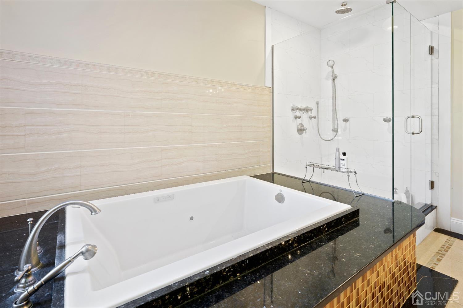 429 Plainfield Road Edison, NJ 08820 - Photo 18 of 26 a bathroom with a tub and a sink