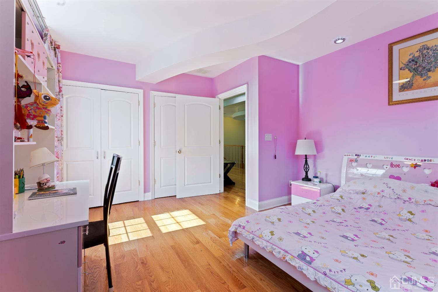 429 Plainfield Road Edison, NJ 08820 - Photo 21 of 26 a bedroom with pink walls and a bed