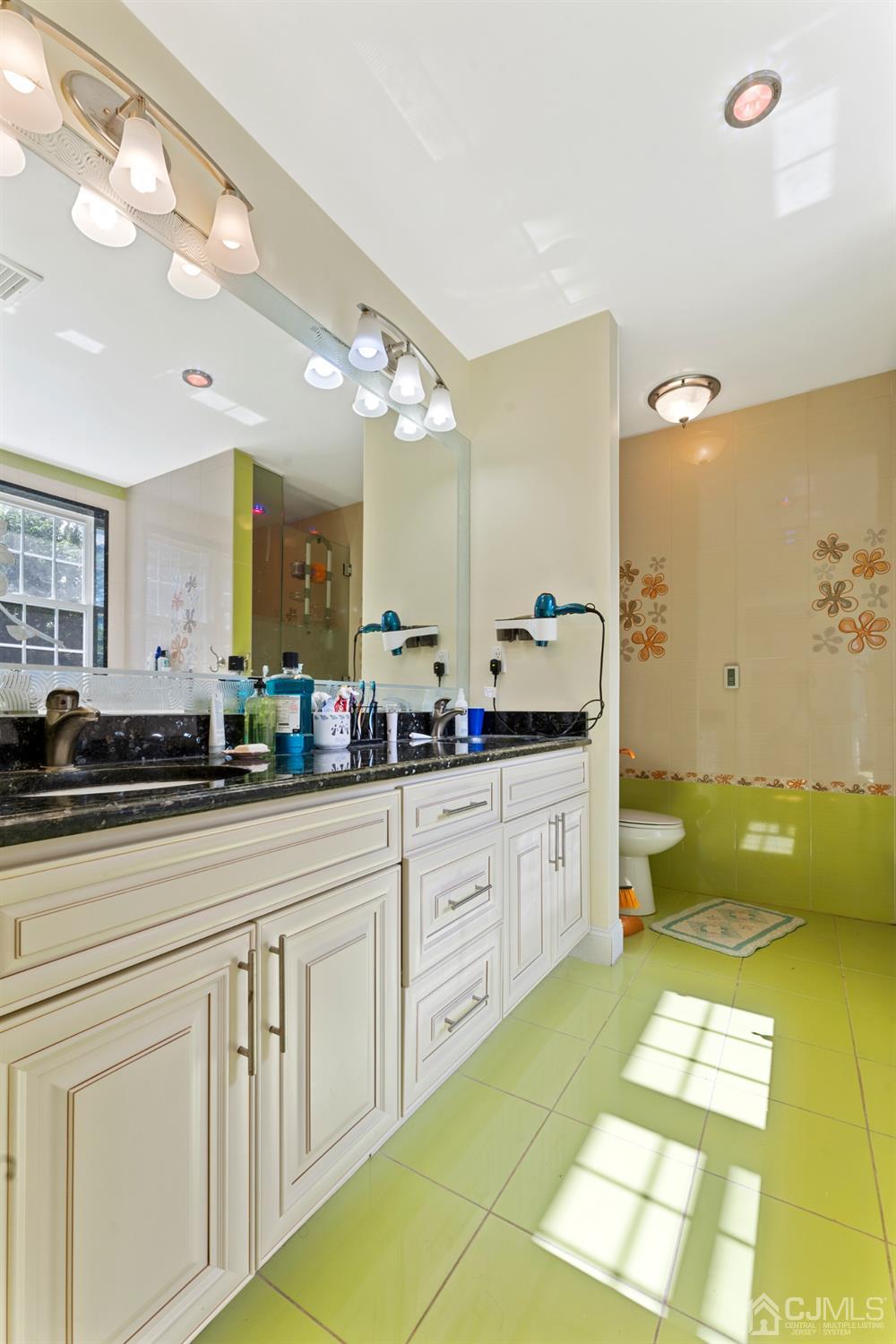 429 Plainfield Road Edison, NJ 08820 - Photo 23 of 26 a spacious bathroom with a granite countertop sink and a mirror