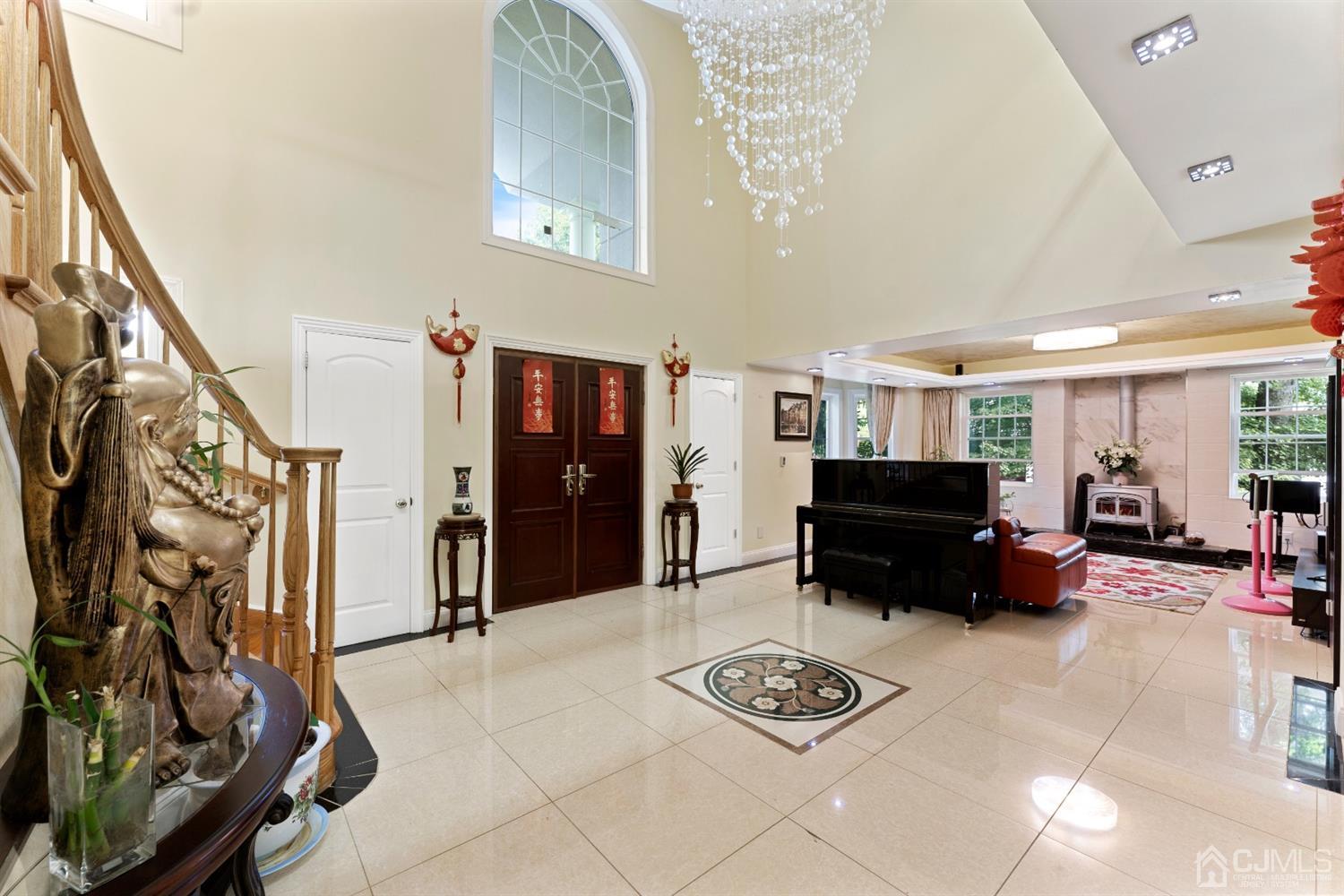 429 Plainfield Road Edison, NJ 08820 - Photo 4 of 26 a living room with furniture and a fireplace
