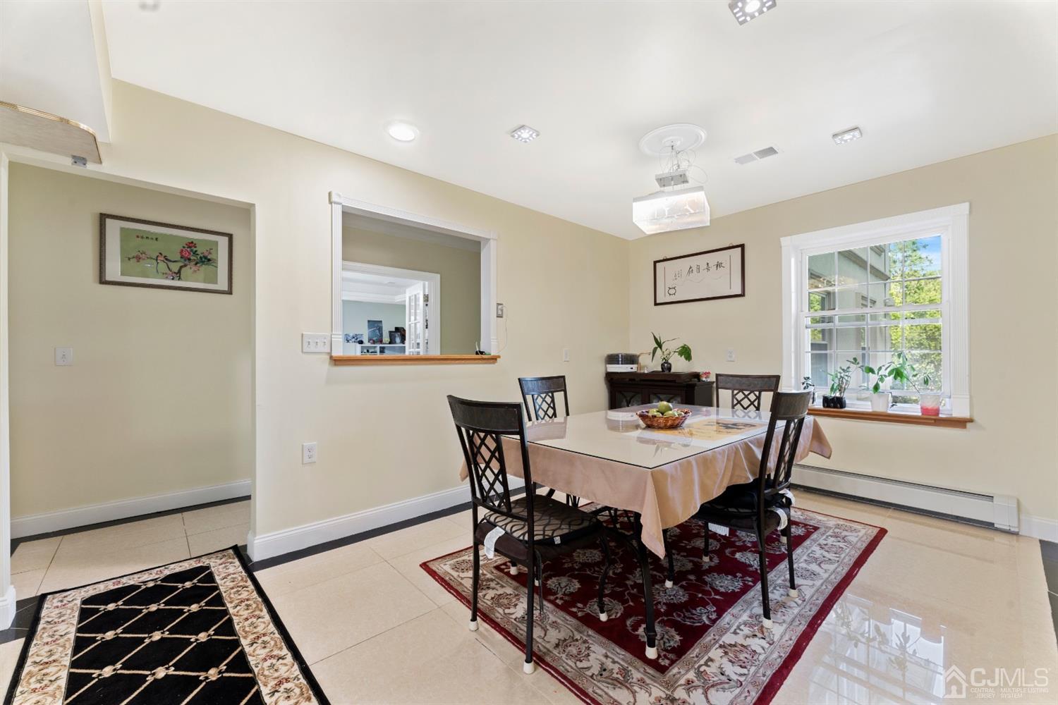 429 Plainfield Road Edison, NJ 08820 - Photo 8 of 26 a view of a dining room with furniture and wooden floor