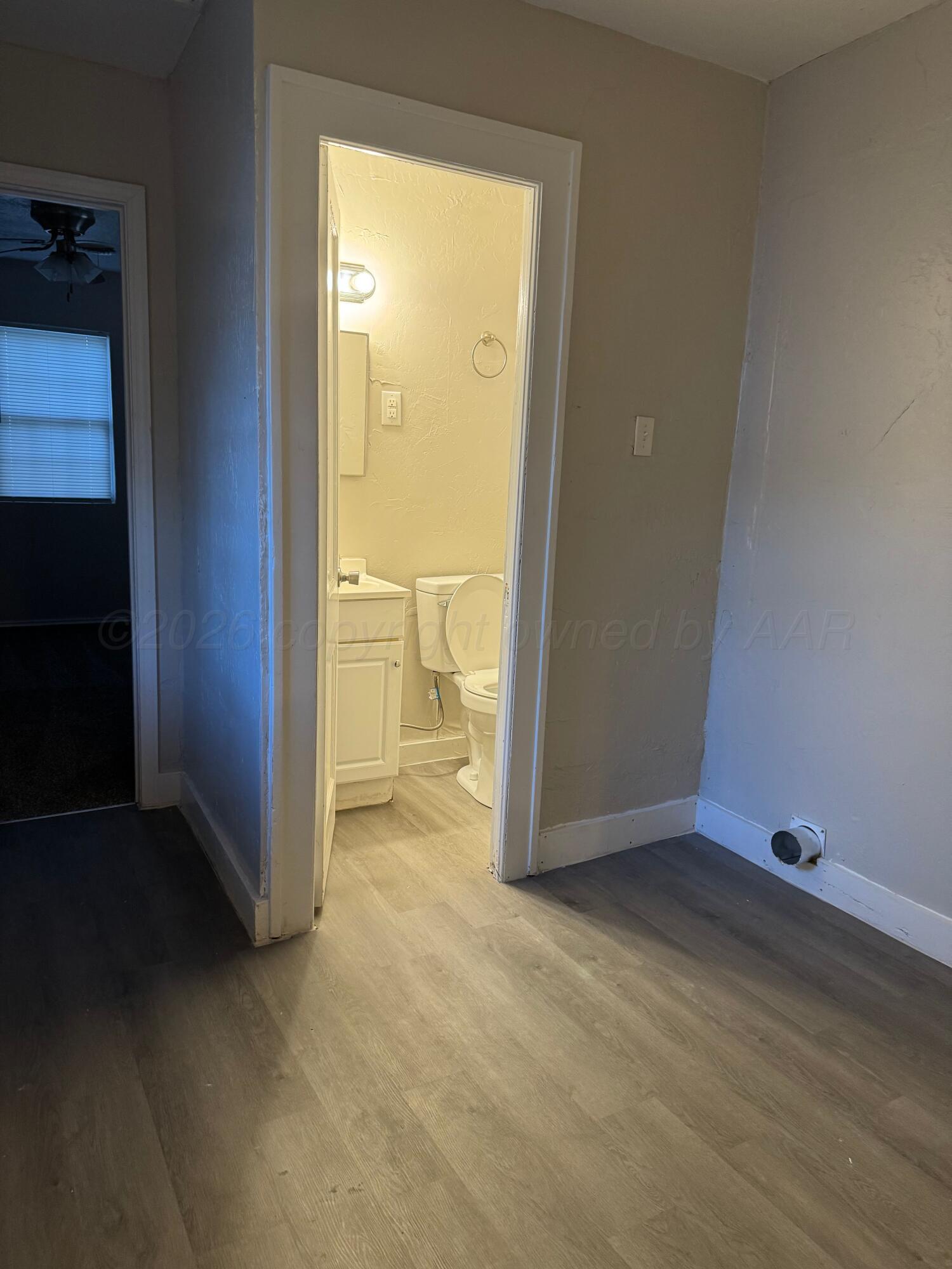 3807 South Polk Street Amarillo, TX 79110 - Photo 11 of 17 an empty room with a door
