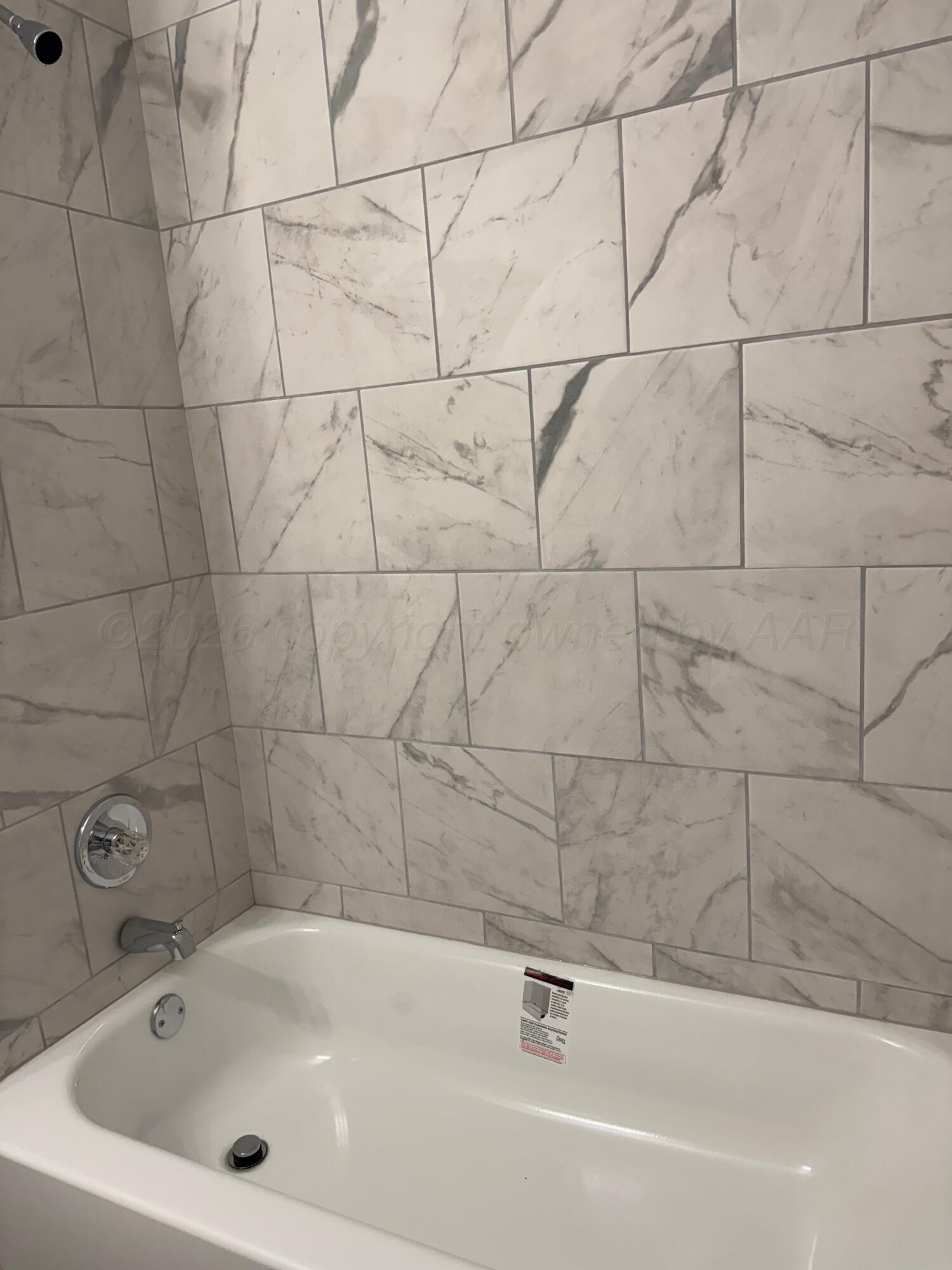 3807 South Polk Street Amarillo, TX 79110 - Photo 13 of 17 a bathroom with a bathtub