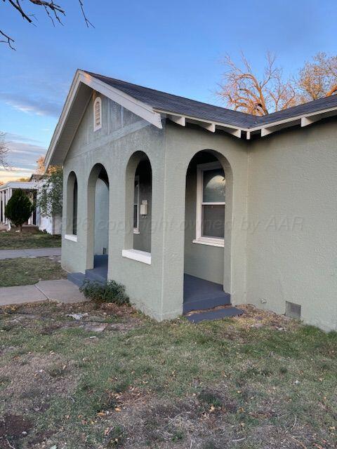 3807 South Polk Street Amarillo, TX 79110 - Photo 2 of 17 a front view of a house with garden