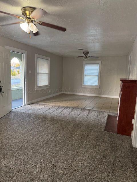 3807 South Polk Street Amarillo, TX 79110 - Photo 4 of 17 a view of a livingroom with a ceiling fan and window