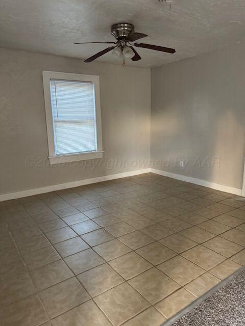 3807 South Polk Street Amarillo, TX 79110 - Photo 8 of 17 an empty room with a empty space and a window