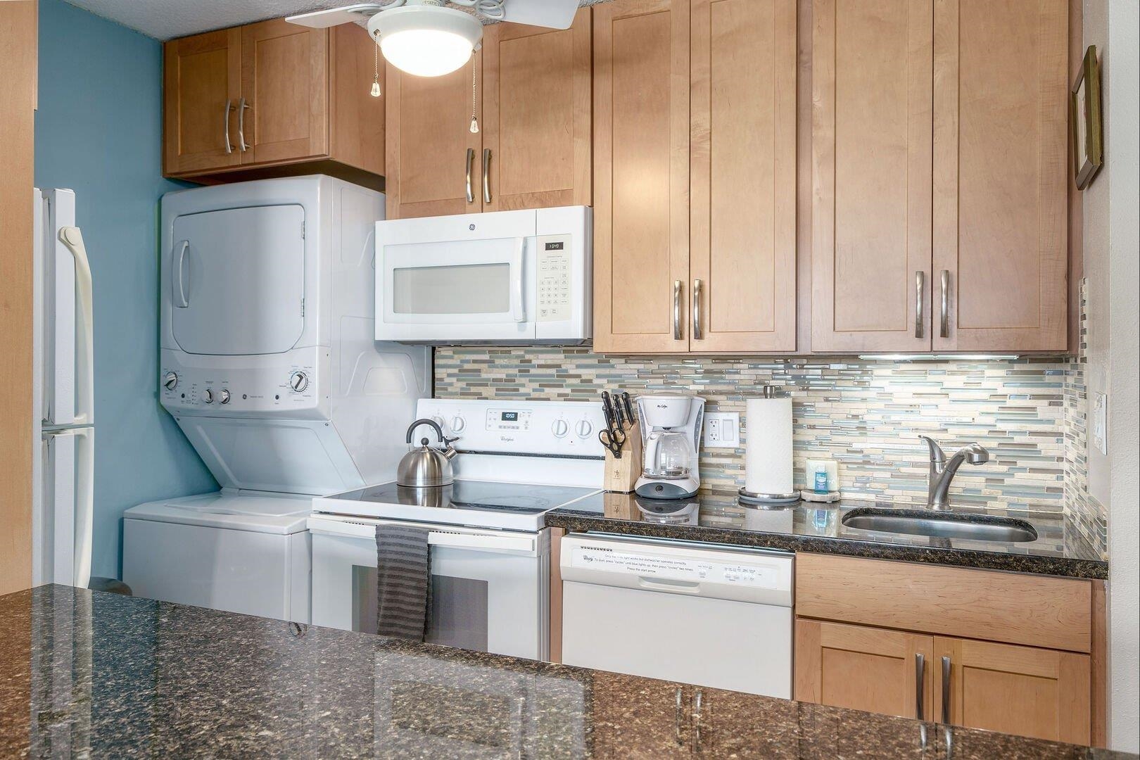 2385 South Kihei Road, Unit 409 Kihei, HI 96753 - Photo 11 of 34 a kitchen with stainless steel appliances granite countertop a sink stove and cabinets