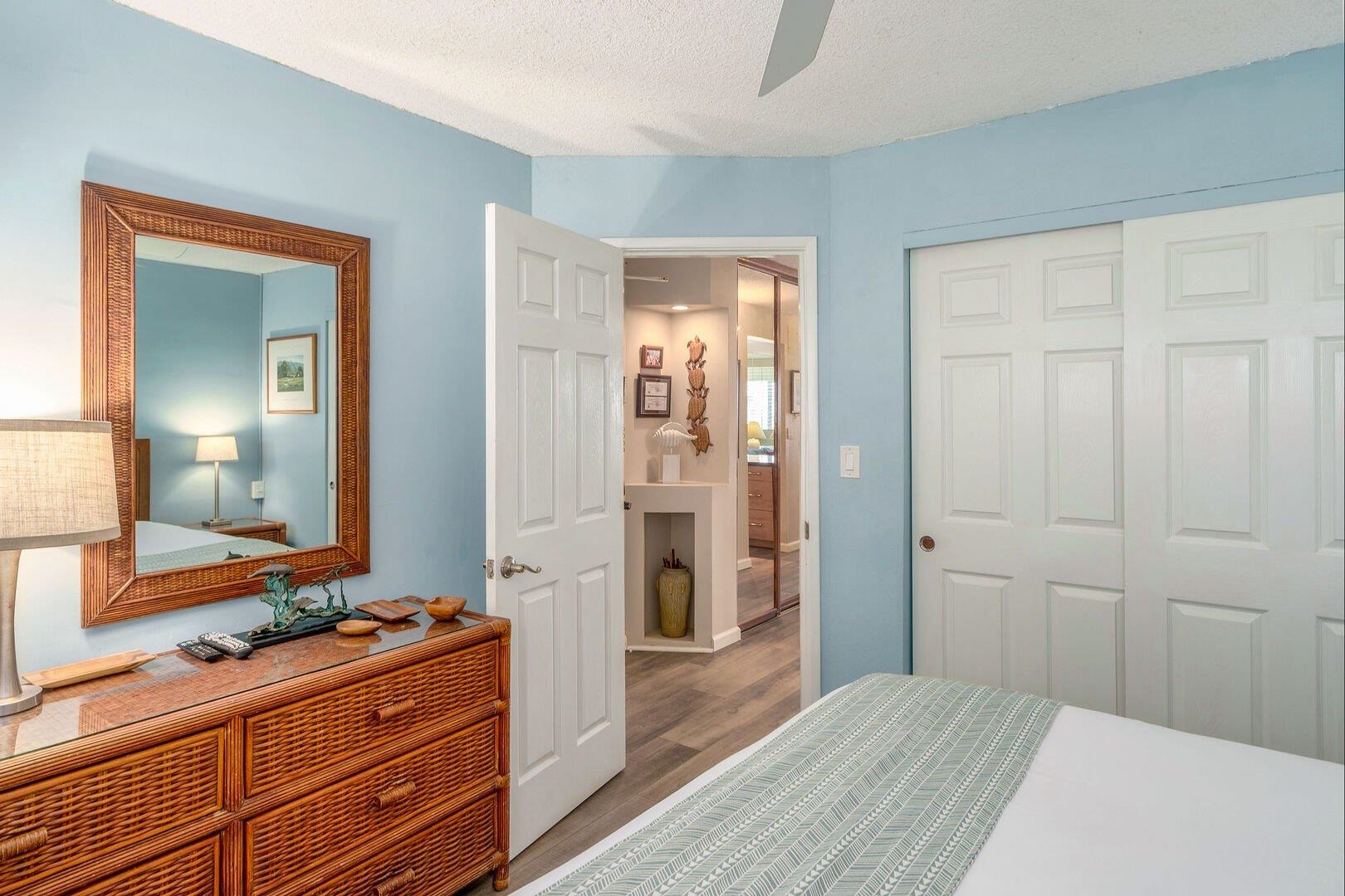 2385 South Kihei Road, Unit 409 Kihei, HI 96753 - Photo 17 of 34 a bedroom with a bed and a mirror on dresser