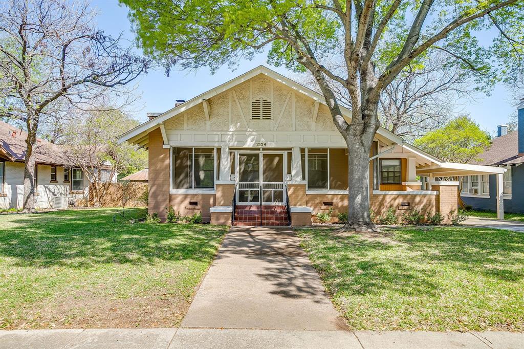 2124 Weatherbee Street Fort Worth, TX 76110 - Photo 2 of 39 a front view of a house with a garden