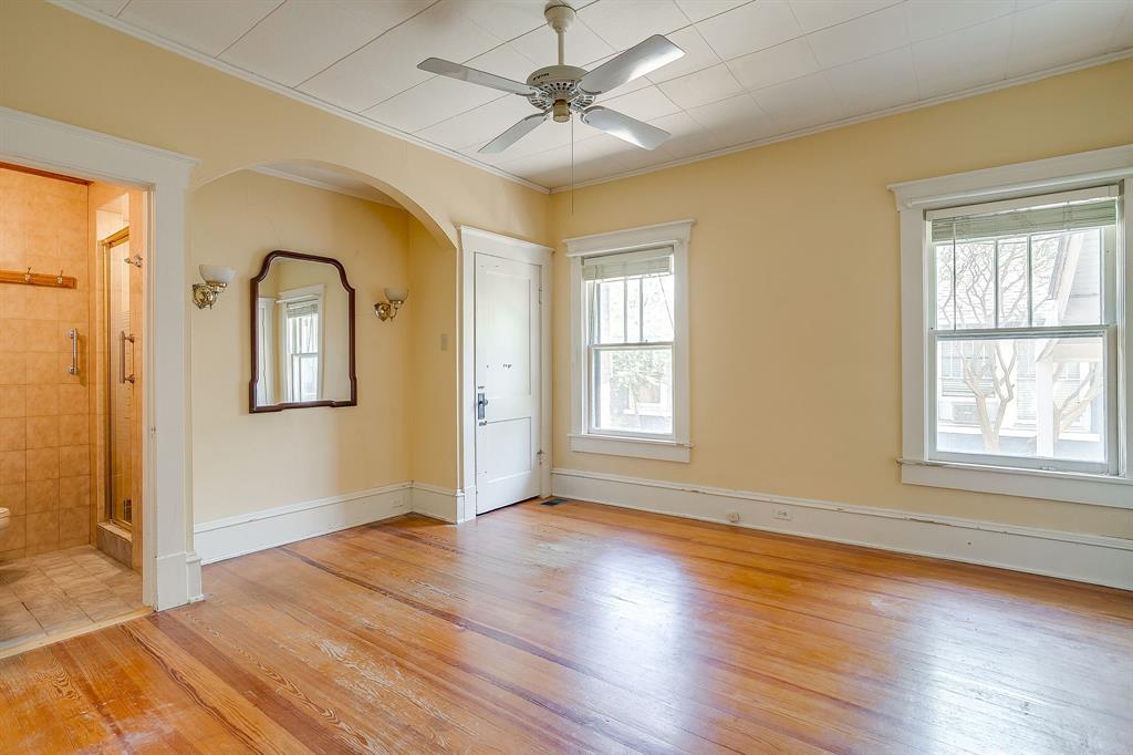 2124 Weatherbee Street Fort Worth, TX 76110 - Photo 25 of 39 a view of empty room with wooden floor and fan