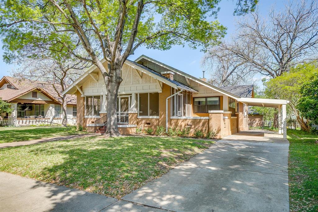 2124 Weatherbee Street Fort Worth, TX 76110 - Photo 4 of 39 a front view of a house with a yard