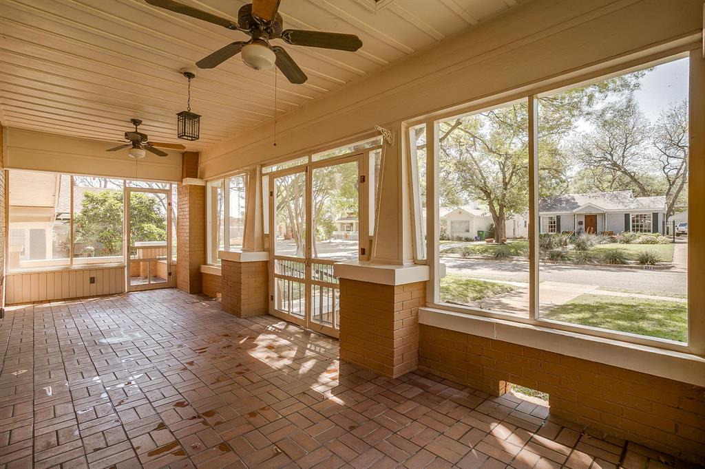 2124 Weatherbee Street Fort Worth, TX 76110 - Photo 6 of 39 a living room with hardwood floor and large windows