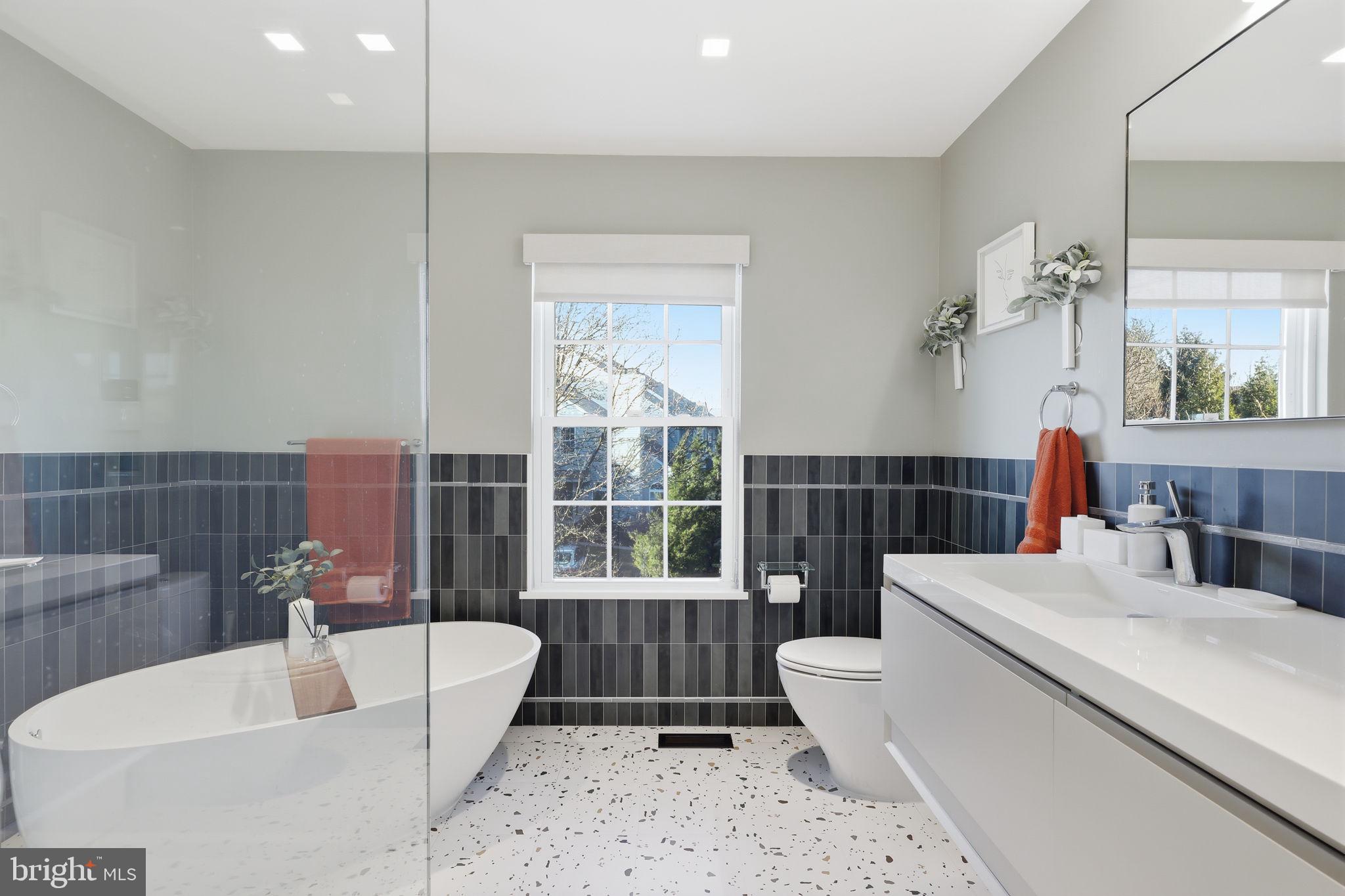 426 Fairview Way New Hope, PA 18938 - Photo 32 of 40 a bathroom with a bathtub a toilet a sink and a large window