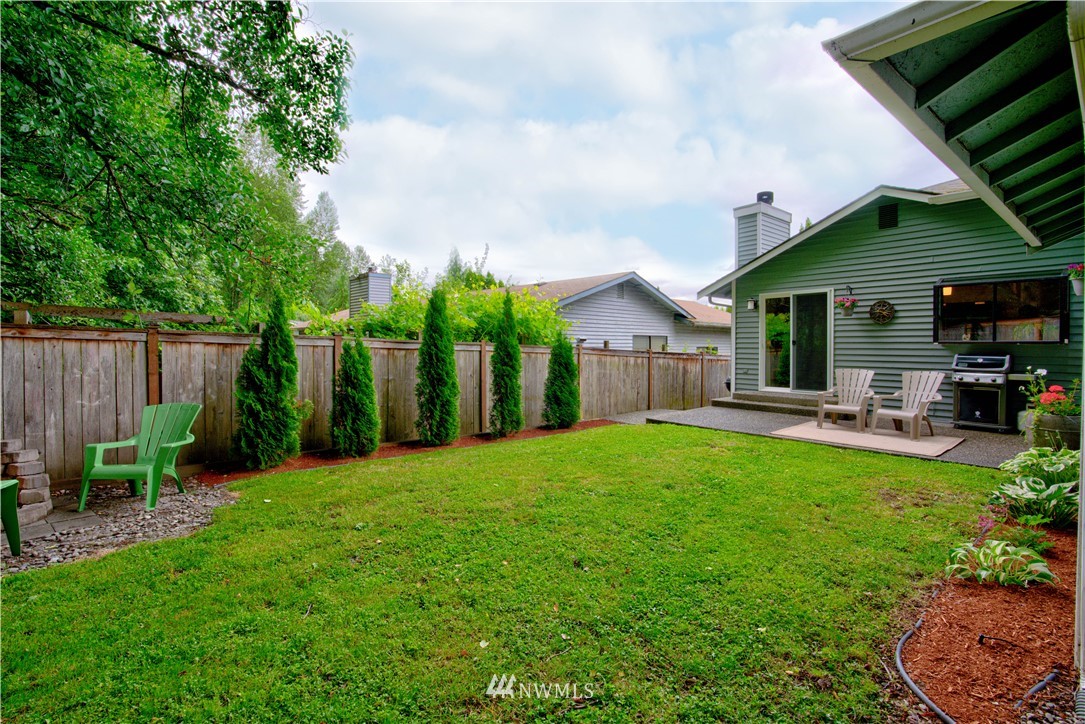 23305 12th Place West Bothell, WA 98021 - Photo 22 of 24 a front view of a house with garden and porch