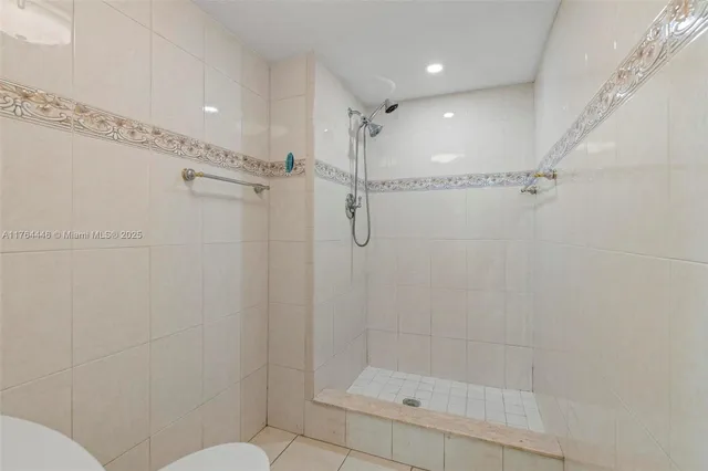 a bathroom with a shower and toilet