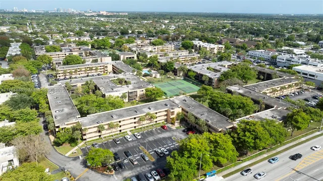 an aerial view of residential houses with outdoor space