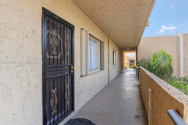 a view of a entryway door with wooden floor